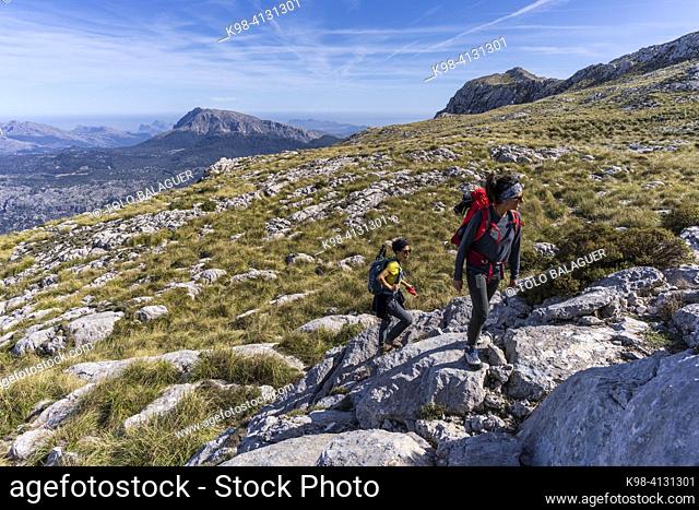 two hikers in the tramuntana mountains, Escorca, Majorca, Balearic Islands, Spain