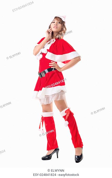 Sexy Christmas girl of Asian standing and smiling at the studio, full length portrait isolated