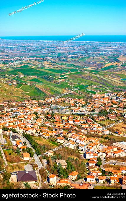 Roofs of Borgo Maggiore in San Marino and valley of Emilia-Romagna in Italy