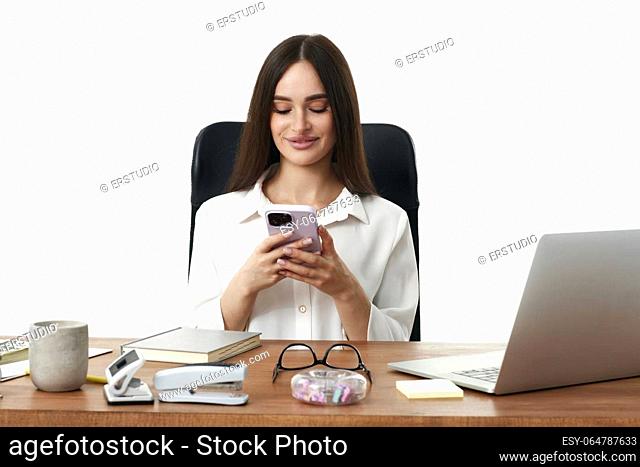 positive business woman using phone in the office