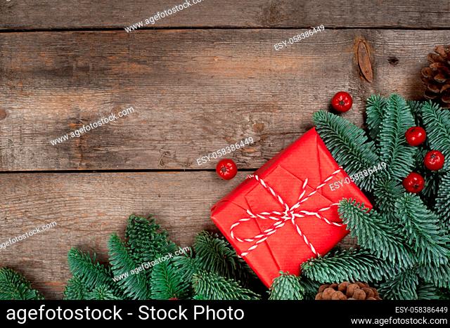 Christmas or New Year background composition made of Xmas decorations and fir tree branches and gift with copy space for text