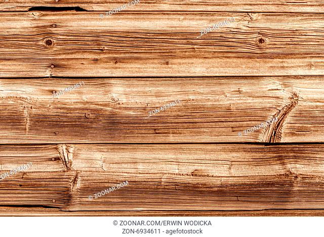 Eine Holzwand aus alten Brettern gebaut. Konzept Foto für Hintergünde