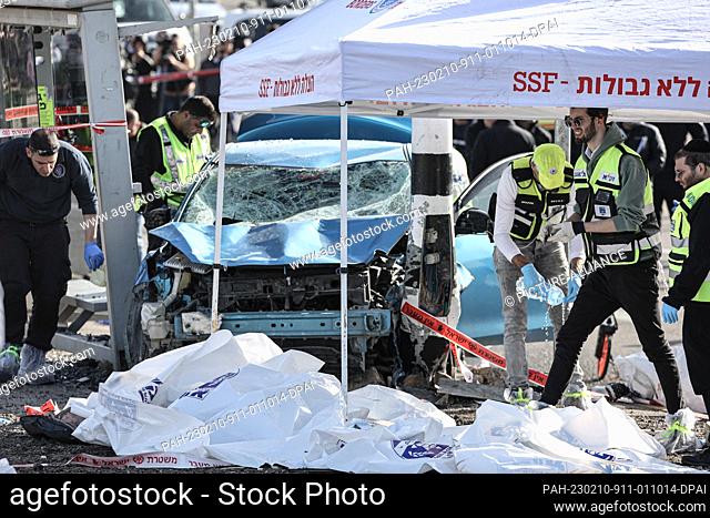 10 February 2023, Israel, Jerusalem: Israeli emergency responders work on a scene where two people were killed, one a 6-year-old child