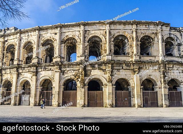 Tourists Ancient Classical Roman Amphitheatre Arena Nimes Gard France. Built in 70 AD Used now for bull fights and sports events