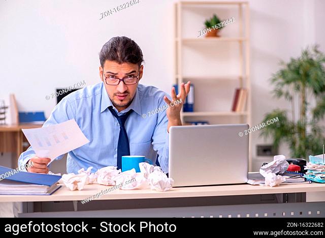 Sick male employee suffering at the workplace