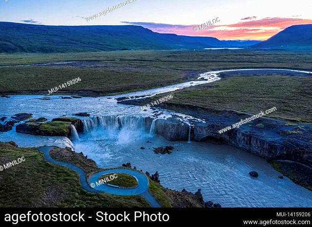 the aerial view of the beautiful waterfall of godafoss at link sunset, iceland in the summer season