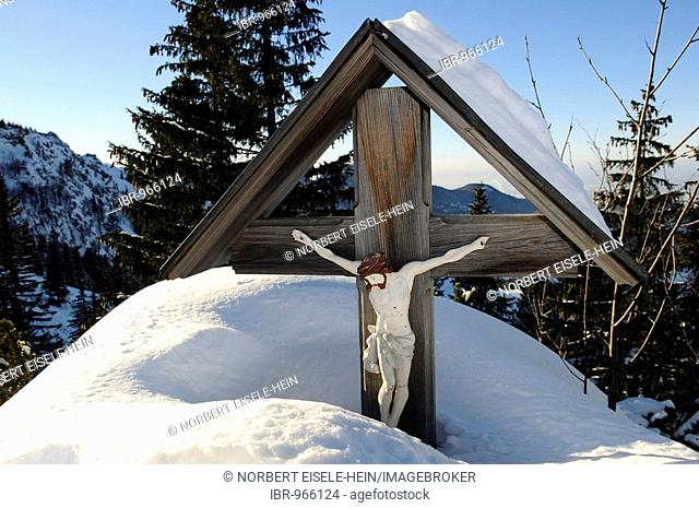 Snowed in wayside shrine with a figure of Christ, Mt. Kampenwand, Aschau, Chiemgau, Bavarian Alps, Bavaria, Germany, Europe