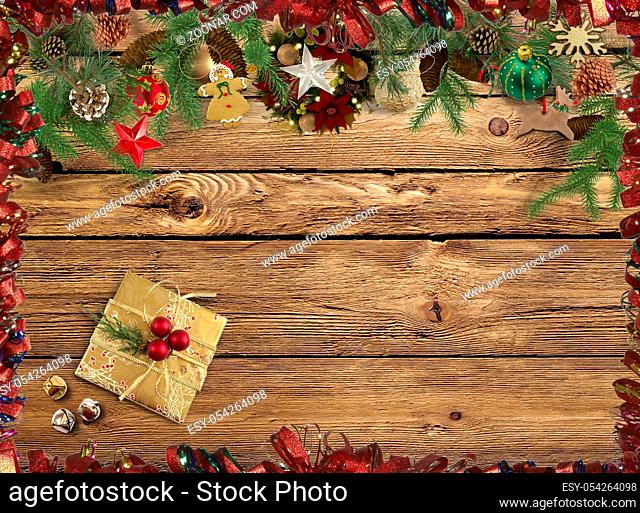 Symbols of Christmas: decorations, gifts, fir branches on wooden background