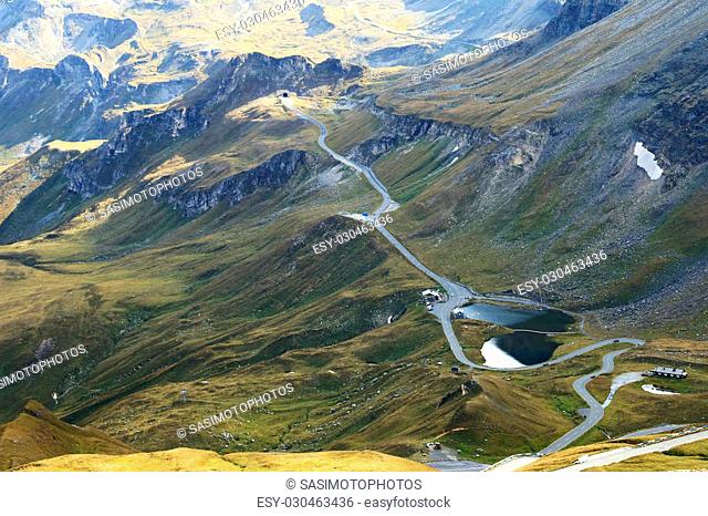 View of the Fuscher lake and Grossglockner High Alpine Road (Hochalpenstrasse). The windy road with 36 bends that leads to the heart of the Hohe Tauern National...