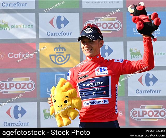 Belgian Remco Evenepoel of Quick-Step Alpha Vinyl celebrates in the red jersey for leader in the overall ranking after stage 9 of the 2022 edition of the...