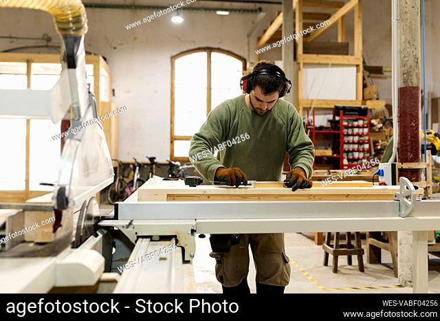 Craftsman working at workbench in industry