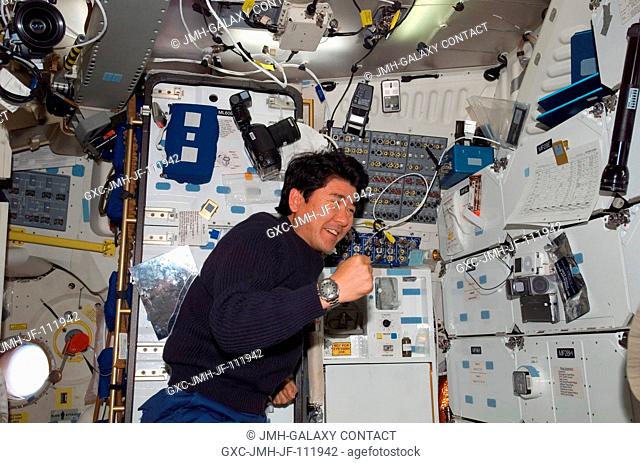 Japan Aerospace Exploration Agency (JAXA) astronaut Takao Doi, STS-123 mission specialist, is pictured near the galley on the middeck of Space Shuttle Endeavour...