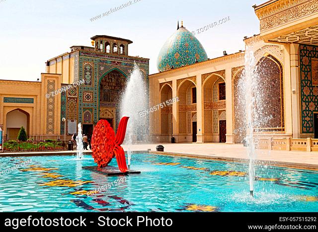 in iran the old   mosque and traditional wall tile incision near fountain minaret