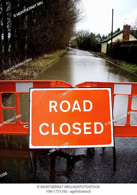 Flooded country road with road closed sign in Thurston Bury St Edmunds, Suffolk, UK
