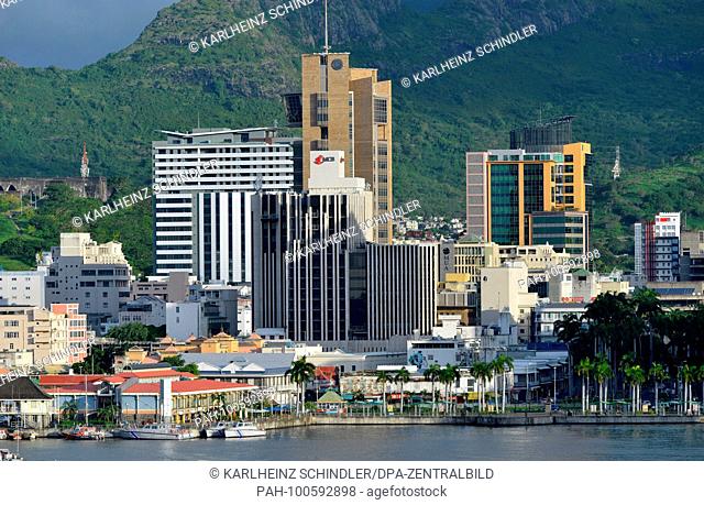 25 January 2018, Mauritius, Port Louis: View across the water of the modern city center with office towers and Le Caudan Waterfront in Port Louis