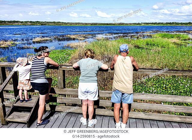 Florida, Sarasota, Myakka River State Park, nature, natural scenery, Lake Myakka, trail, path, raised boardwalk, family, looking, girl, mother, grandmother