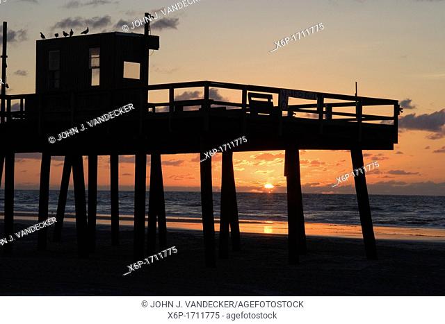 Sunrise at a fishing pier, Wildwood Crest, New Jersey, USA  Wildwood Crest is a popular shore resort near Cape May, New jersey