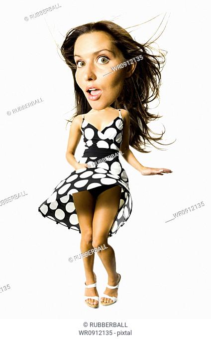 Womans polka dot dress blowing in breeze