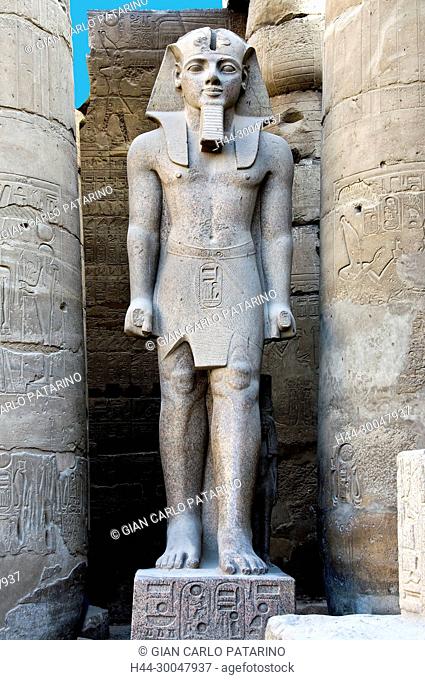 Luxor, Egypt. Temple of Luxor: a giant statue of the pharaoh Ramses II (1303-1212 b.C.) in the courtyard