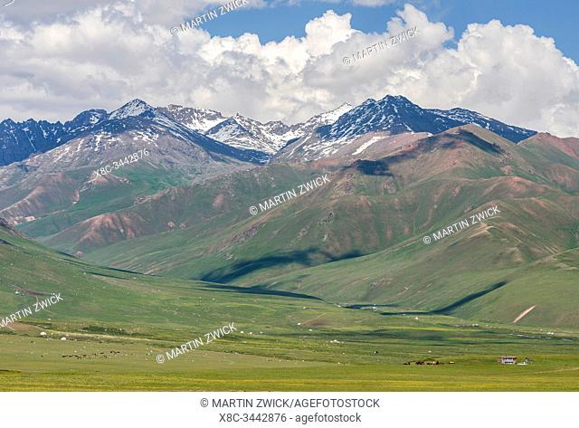 Summer pasture with traditional Jurts. The Suusamyr plain, a high valley in Tien Shan Mountains. Asia, central Asia, Kyrgyzstan