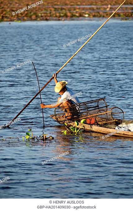 Fisherman in Southern Thailand with fish-traps