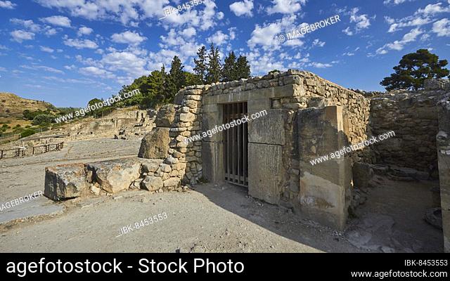 Morning light, blue sky, white clouds, stone building, lattice door, staircase, Minoan Palace of Festos, Messara Plain, Central Crete, Crete Island, Greece