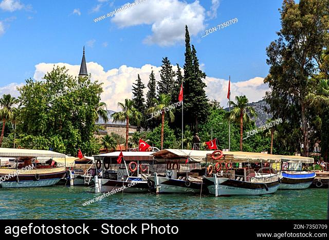 DALYAN, TURKEY - MAY 31, 2015 : Boats for touristic boat trips in the river between Koycegiz Lake and Iztuzu Beach in Dalyan
