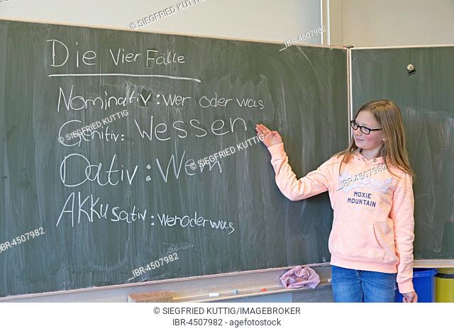 Girl at blackboard in German class, elementary school, Germany