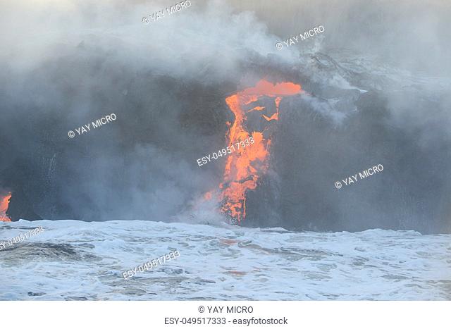 lava flow to pacific ocean at big island, hawaii