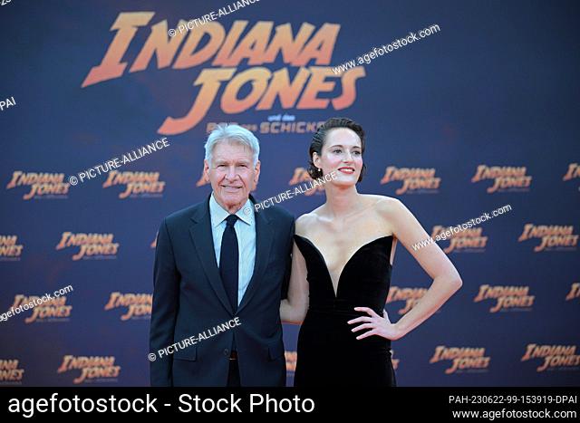 22 June 2023, Berlin: Harrison Ford and Phoebe Waller-Bridge stand on the red carpet at the German premiere of the film ""Indiana Jones and the Wheel of...