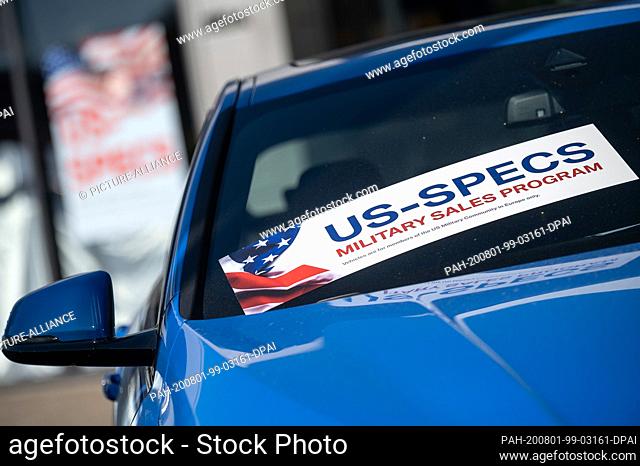 31 July 2020, Baden-Wuerttemberg, Stuttgart: ""US-Specs Military Sales Program"" is written on a sticker that is attached to a car at a car dealership near the...