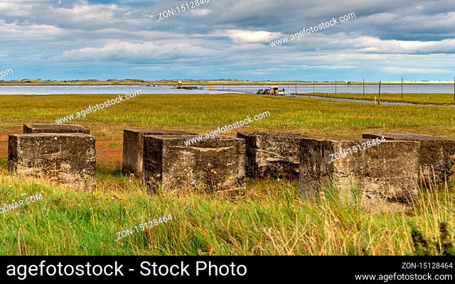 Near Beal, Northumberland, England, UK - September 08, 2018: Flooded Road to the Holy Island of Lindisfarne with cars and people waiting