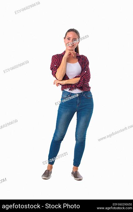 Full length portrait of smiling young woman with her hand on chin isolated on white background, casual people