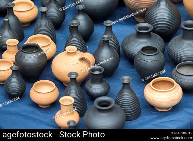 Clay vessels of different colors. Ceramics