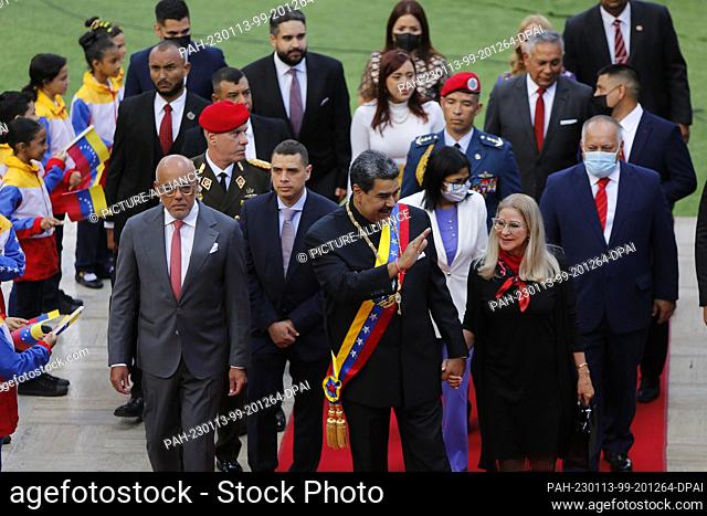 12 January 2023, Venezuela, Caracas: Nicolas Maduro, president of Venezuela, walks next to his wife, Cilia Flores, at the Palacio Federal Legislativo before his...
