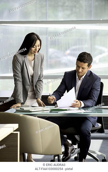 Secretary working with executive