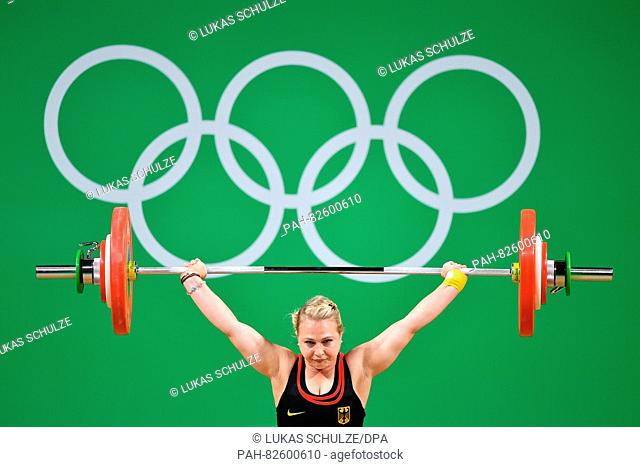 Sabine Kusterer of Germany competes during the Women's 58kg Group B category of the Rio 2016 Olympic Games Weightlifting events at the Riocentro in Rio de...