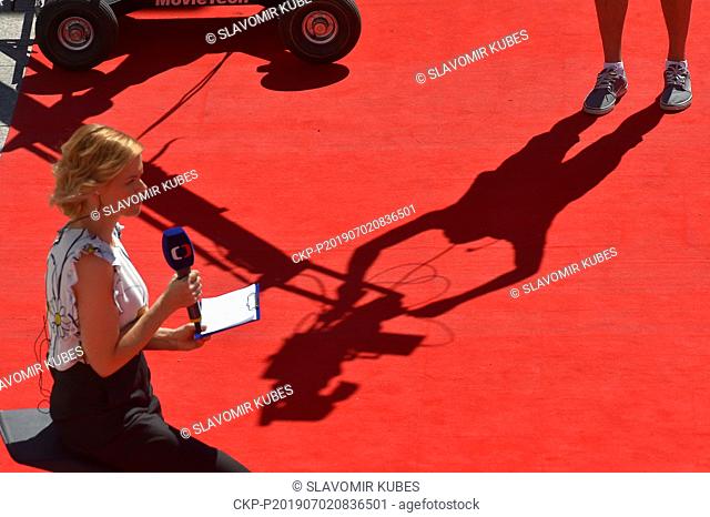 The Czech television redactor Katarina Bilkova makes her transmission from the red carpet at the 54th Karlovy Vary International Film Festival in Karlovy Vary