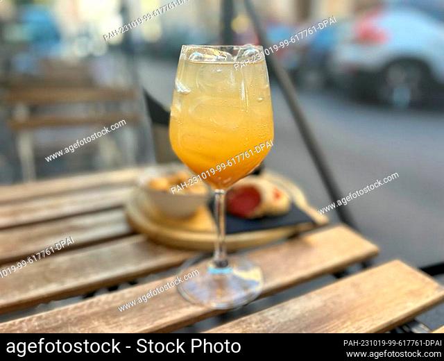 11 October 2023, Italy, Rom: The ""Bellini"" stands on a table in the outdoor area of a bar. The ""Bellini"" is such a classic that you can even get it in...