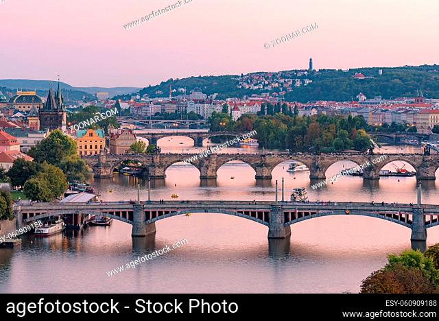 View of three bridges over the River Vltava at sunset time in Prague, Czech Republic