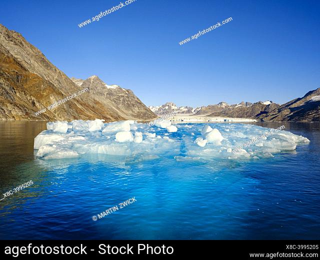 Iceberg in front of Knud Rasmusen Glacier (also called Apuseeq Glacier) in Sermiligaaq Fjord. Ammassalik region in the north east of Greenland
