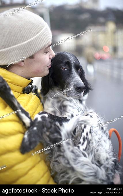 young man with dog in Lyon, France
