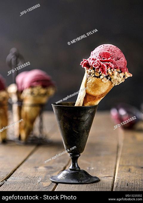 Raspberry sorbet in homemade ice cream cone
