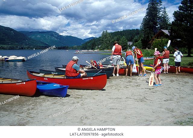 Garibaldi Point. Near Whistler. Beach. Boat hire. Canoes. People in life vests, jackets