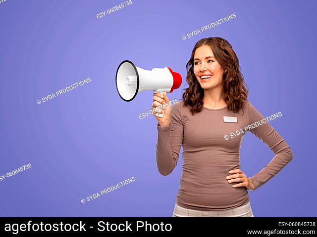 happy female shop assistant with megaphone