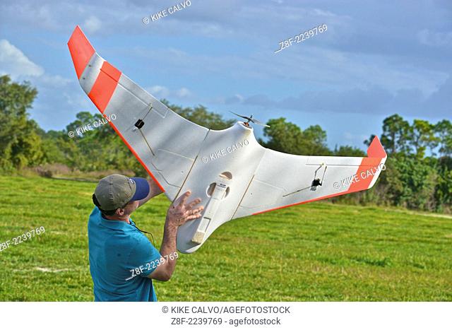Student holds a classic flying wing at a small unmanned aircraft pilot training course at the Unmanned Vehicle University