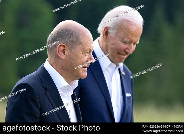 26 June 2022, Bavaria, Elmau: German Chancellor Olaf Scholz (l, SPD), and Joe Biden, President of the USA, arrive for a family photo during the G7 Summit at...