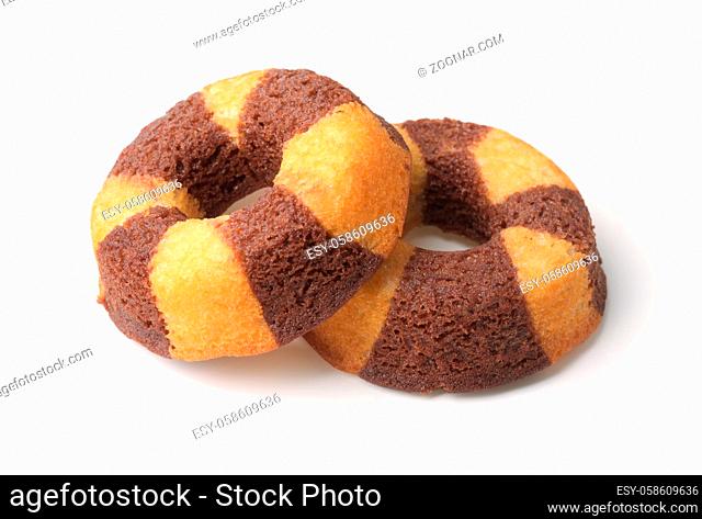 Two chocolate banana sponge cakes isolated on white