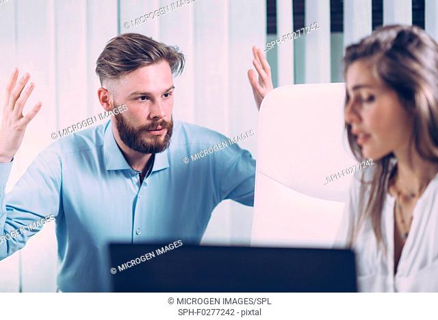 Harassing new employee, conceptual image