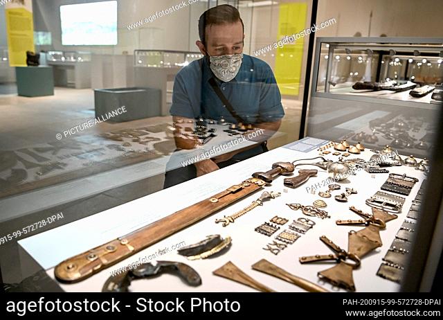 15 September 2020, Berlin: A young man looks at the exhibition ""Germanic people. An Archaeological Inventory"" in the Neues Museum and the James Simon Gallery